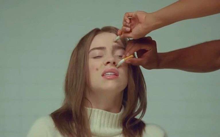 Гасять недопалки об обличчя: Біллі Айліш випустила новий кліп